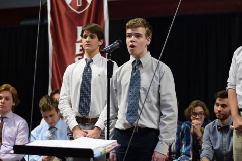 Freshman Thomas Schartner sings at Thanksgiving mass