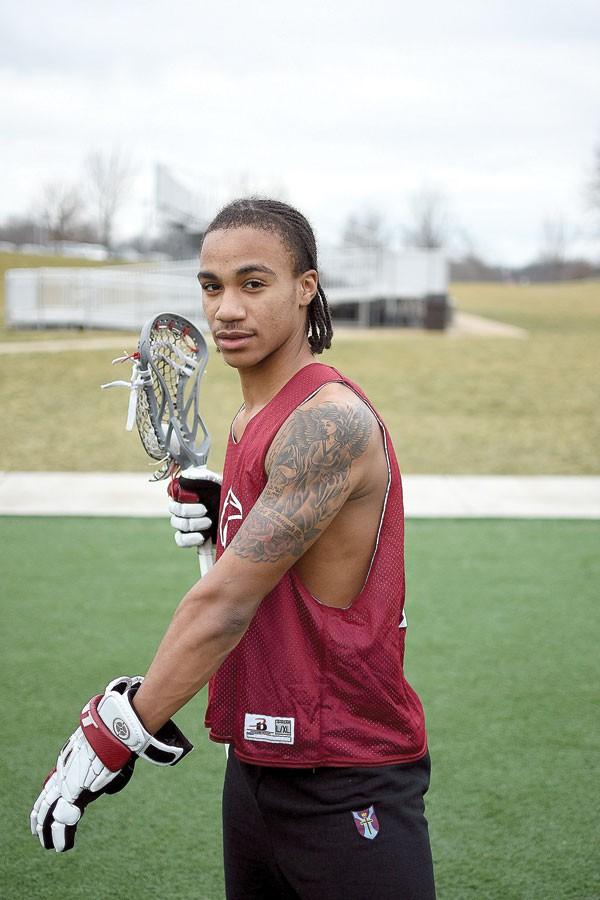 Lenard Jones shows off his tattoo to commemorate his father. 