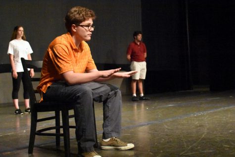 Junior Will Brown reads his lines during rehearsal of "The Laramie Project" Sept. 19.