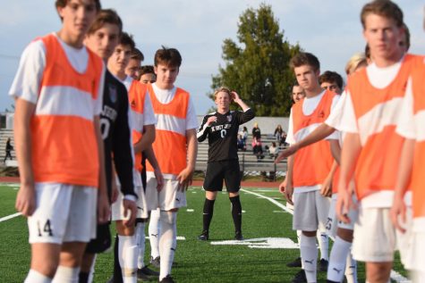 The team forms a tunnel to kick off the Lafayette game.