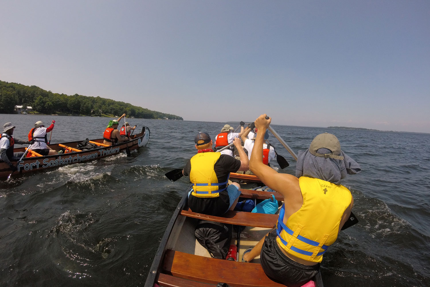 Paddling to Wreck Island, two canoes race to the next stop.