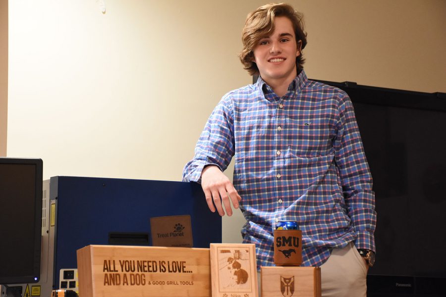 Sophomore Sebastian Martin displays some of the items he has his brother Alex sell on their website etchbrothers.com.