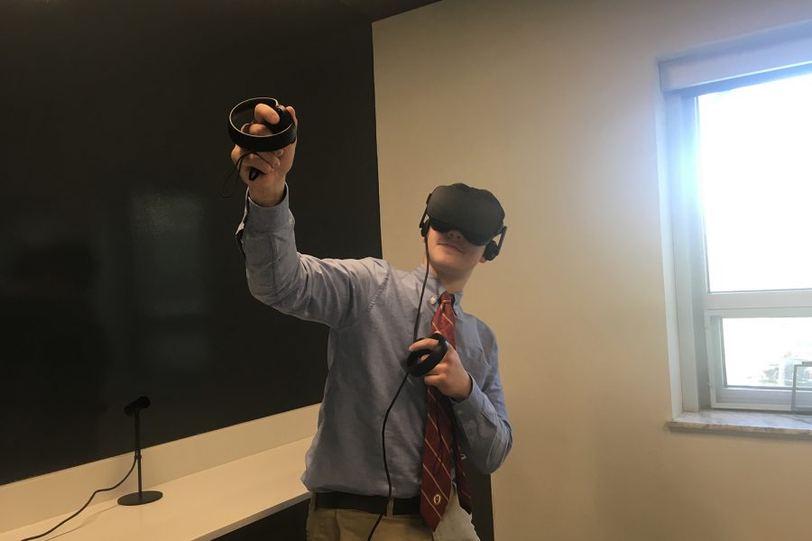 Student demonstrates how the VR room will be used for different types of classes.