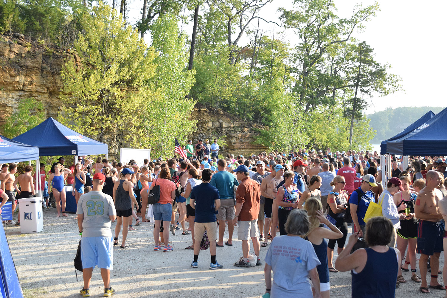 Swim Across America participants listen to personal stories from cancer survivors. The event raised over $200,000 for cancer research.
