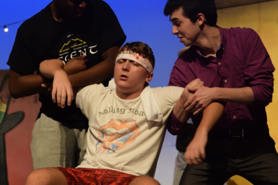 Senior Camden Brazile, playing the character of Scapino, is held up by sophomore David Totty and senior Ethan Aronson. The Dionysian Players will perform Scapino! Oct. 18-20.