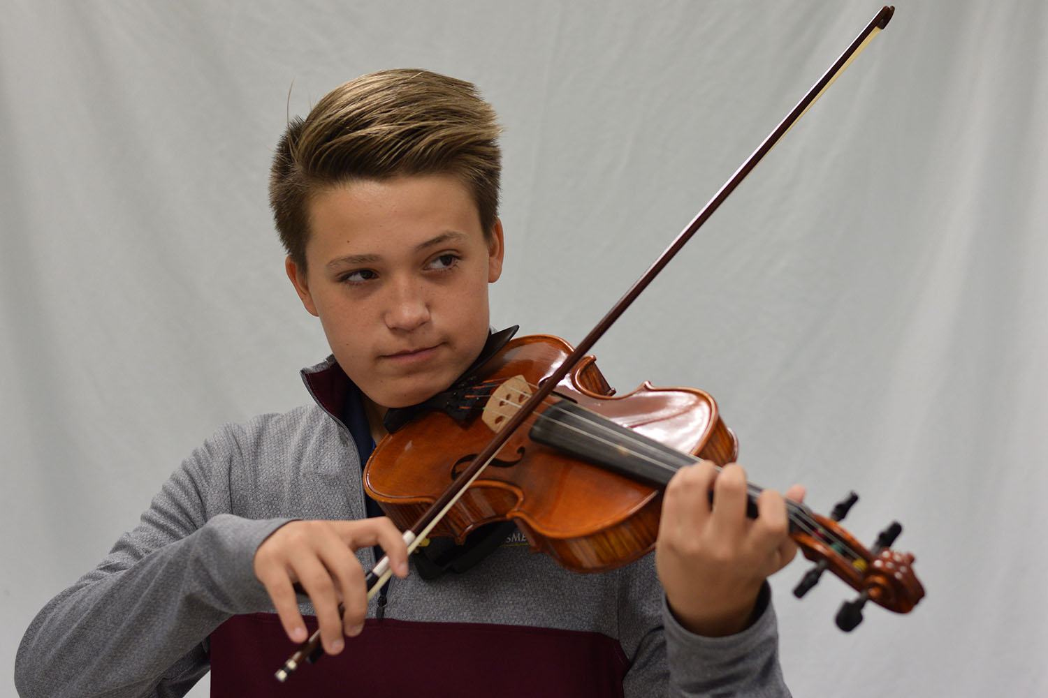 Freshman Emmet Concanon plays his violin. This past summer Concanon traveled with an orchestra across Europe.