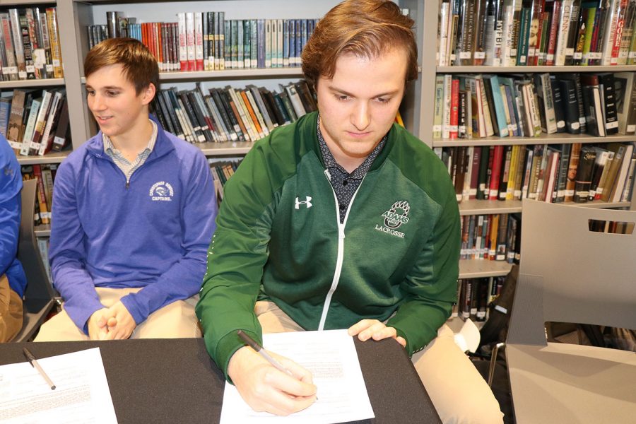 Giuseppo Migliazzo signs a letter of intent to play lacrosse for Adams State University.
