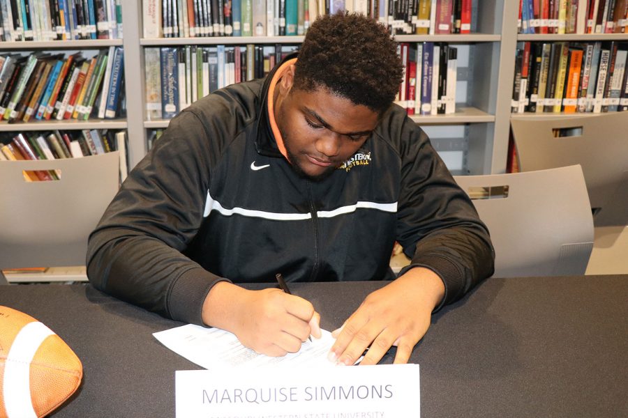 Marquise Simmons signs a letter of intent to play football for Missouri Western University.