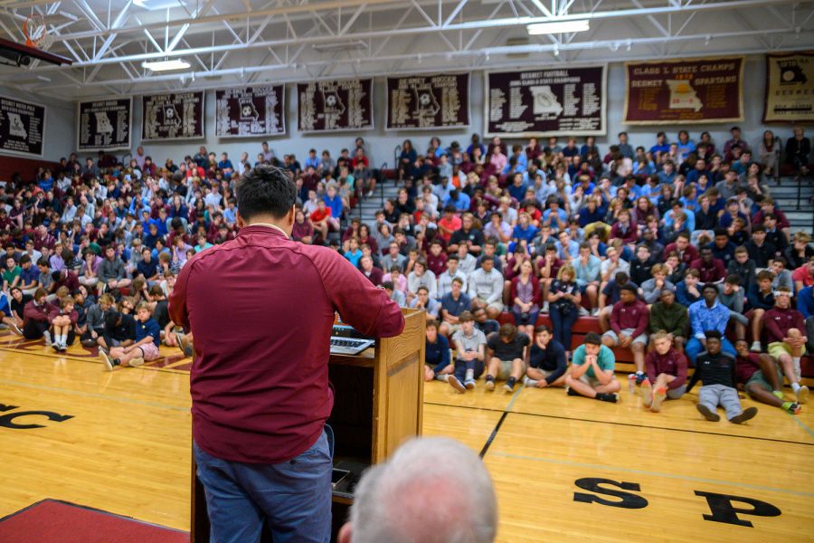 Gael Cosgaya 21 speaks to the student body during the Hispanic Heritage Month assembly about the trials and tribulations of his family as they moved to the United States from Mexico.