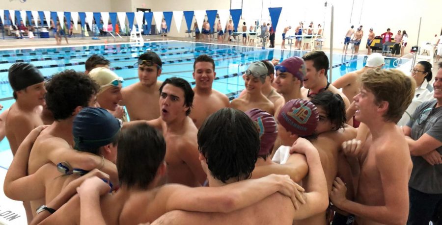 Senior Justin Rothermich gets the team excited and ready for the Westminster swim meet.
