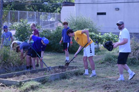 Theology teacher Michael O'Brien leads sophomores in the service portion of the Ascent retreat.