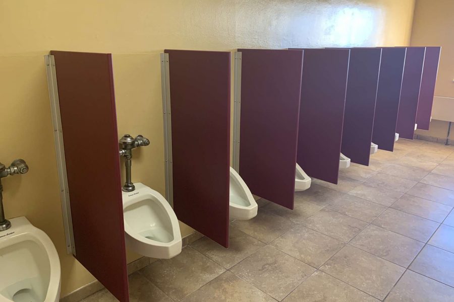 Urinal dividers are set in both of the second floor bathrooms. The Ignatian Business Leaders club raised the funds to pay for the project.