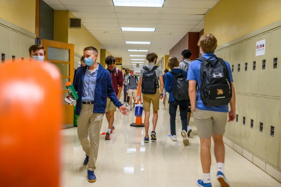 Students walk on the correct side of the hallways to stay spread out and help lower the chances of 	Spreading the Corona Virus.