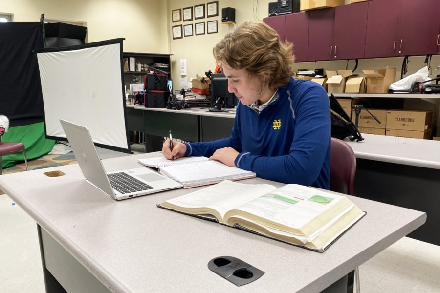 Senior Michael Cutler works on Calculus homework after school on March 11th, 2021.