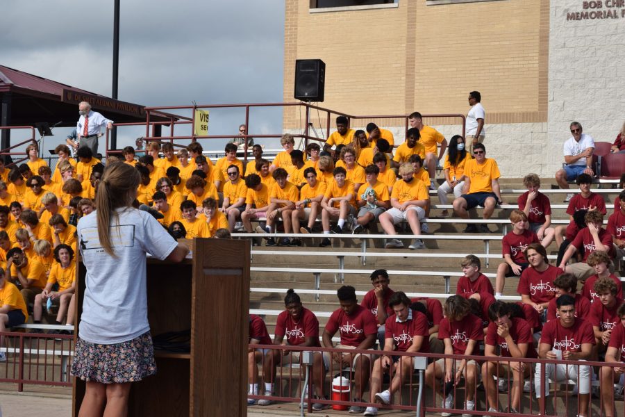 Campus Ministry Director Kelsey Grimm leads De Smet students in prayer before the Mass of the Holy Spirit on Aug. 20 in the stadium.