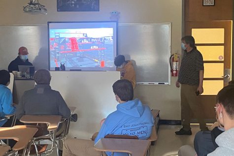 The DURT Robotics team watches the First Robotics Competition (FRC) theme reveal video. The event kicked off the 2022 FRC season.