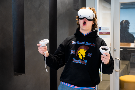 Will Timmons 24,tries out the VR headset available in the VR room.