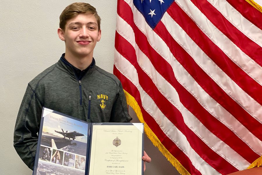 Jesse Hahs 22 holds his acceptance letter from the United States Naval Academy after a nomination from Illinois Congressman Mike Bost.