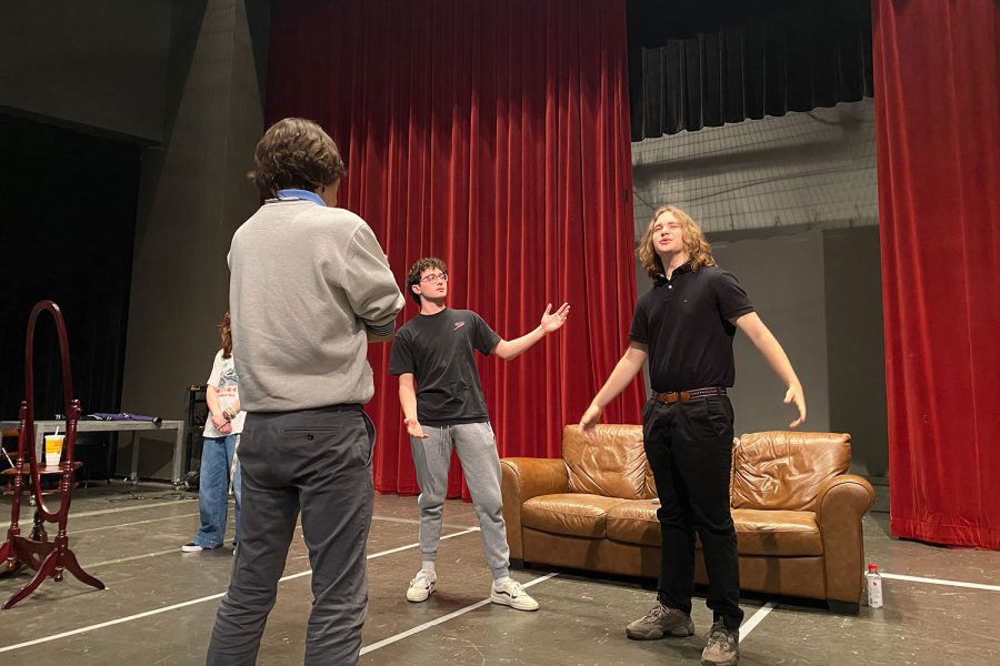 Seamus Flanagan 22 watches as Nico Lionelli 22 and Luke Halski 22 act out a scene from the one act play he is directing. 