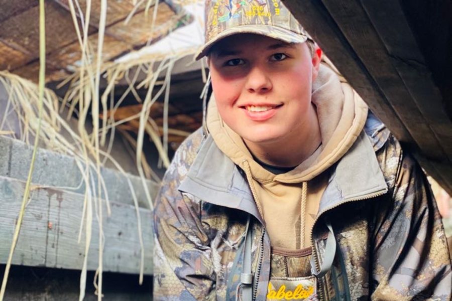 Senior Jack Ulman stands in a duck blind while going hunting. 