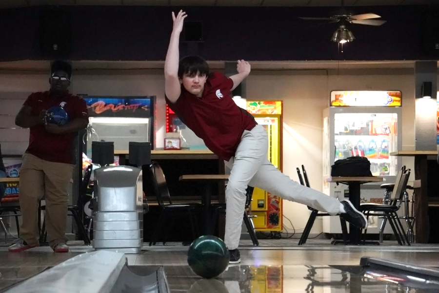 Ben Kinealy 23 practices consistently throwing a strike during the bowling team practice.