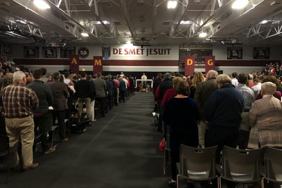 Students, parents, faculty and alumni gather in the gym Dec. 24, 2019 to celebrate mass. It is the last time De Smet hosted the Christmas Eve mass.