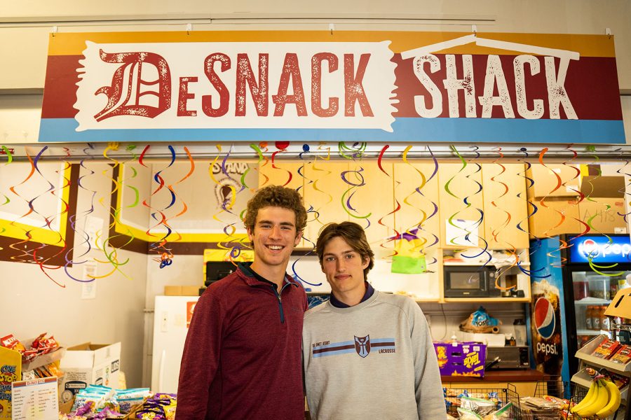 Seniors Brandon Schoen and Thomas Ruder stand in front of the DeSnack Shack.
