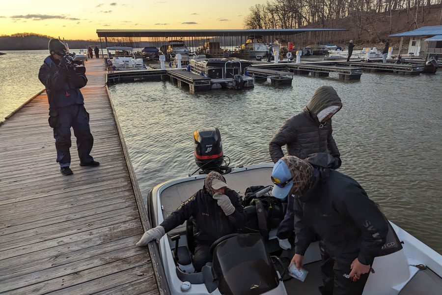 A cameraman filming for the TBF Student Angler Federation documents boat captain Jeff Geiser, Danny Swallow 24, and Mitch Geiser 23 as they prepare to launch in the state tournament April 1 at Lake of the Ozarks.