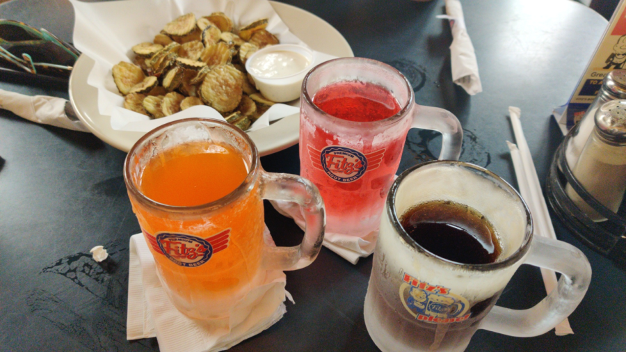 Three frosty sodas and a plate of fried pickle chips on a plate at Fitzs of the Delmar Loop