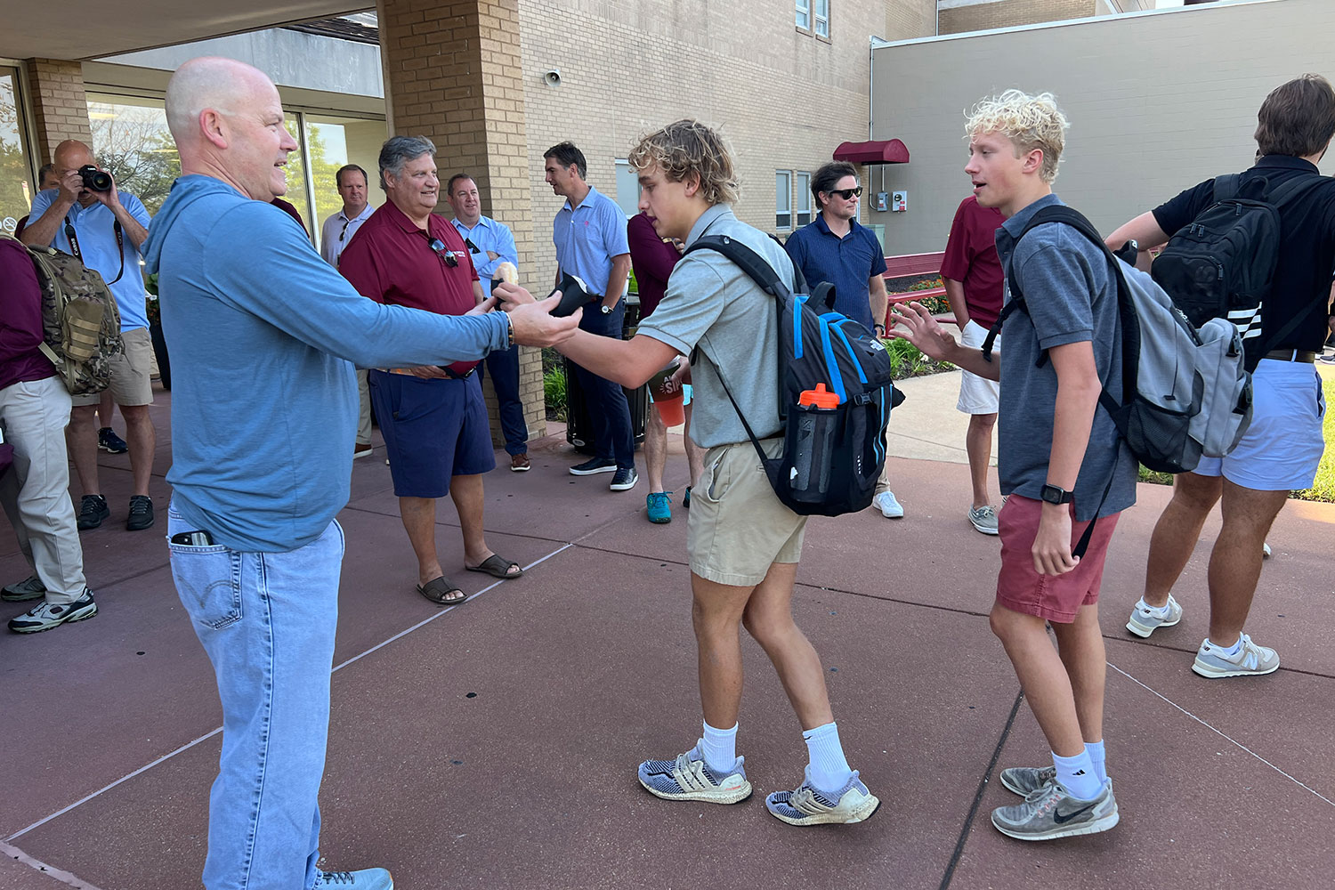 The mens club greet students on the first day of school Aug. 17. Students were met with new attendance policies to help cut down on absences.