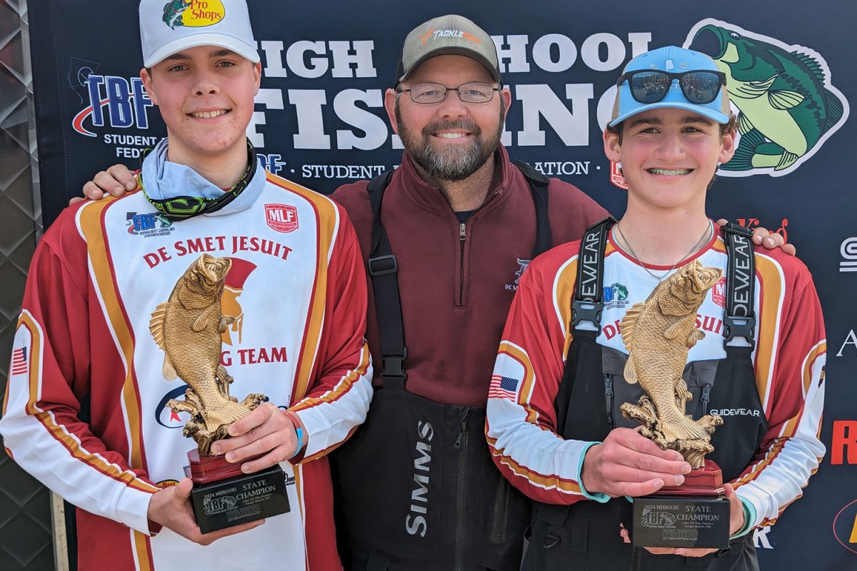 Danny+Swallow+24%2C+boat+captain+Jeff+Geiser%2C+and+Nick+Whitney+24+celebrate+their+2024+TBF+Student+Angler+Federation+Missouri+State+Championship+at+Lake+of+the+Ozarks+March+16.