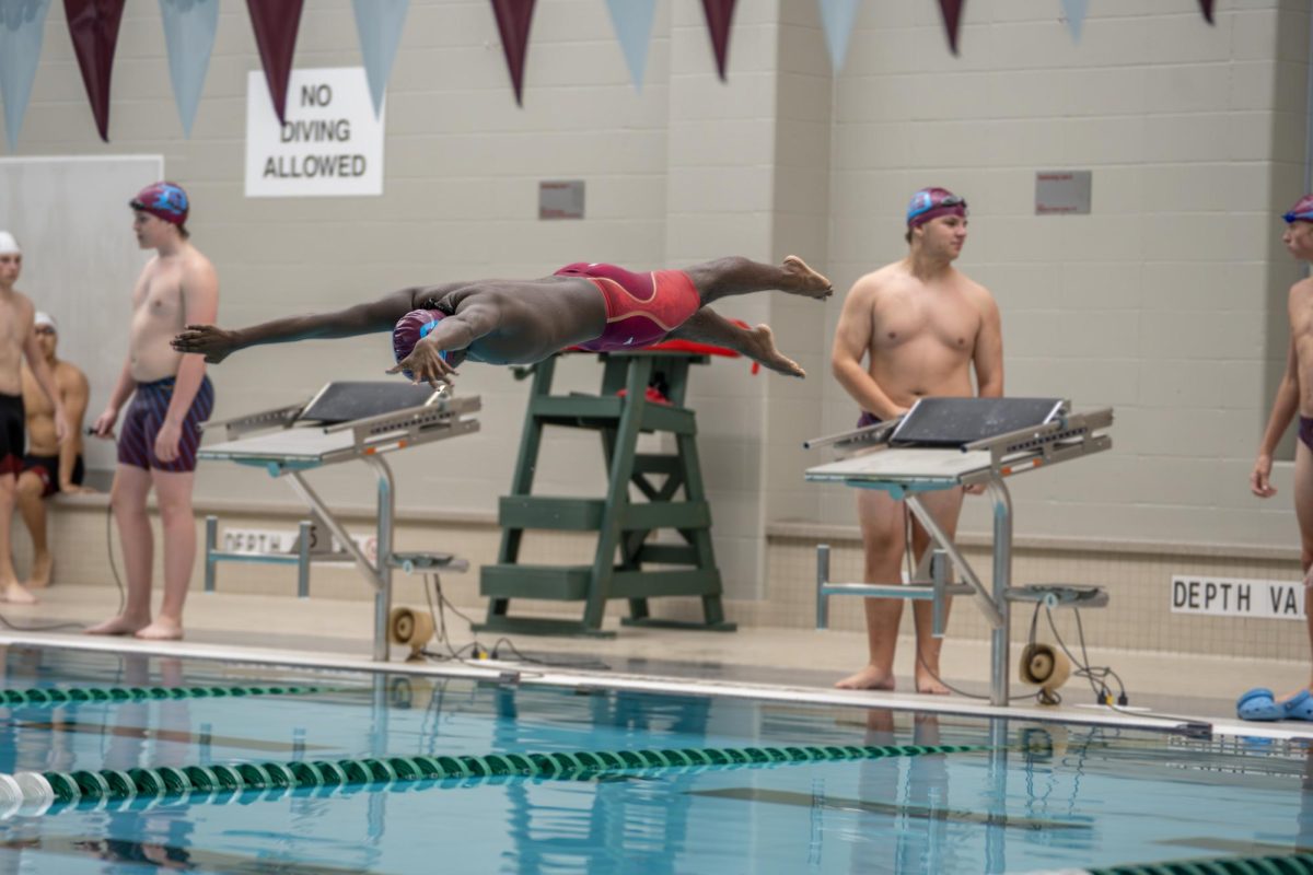 Kashi Chaudhuri '27 dives into the water on September 18th, 2024 vs MICDS. 