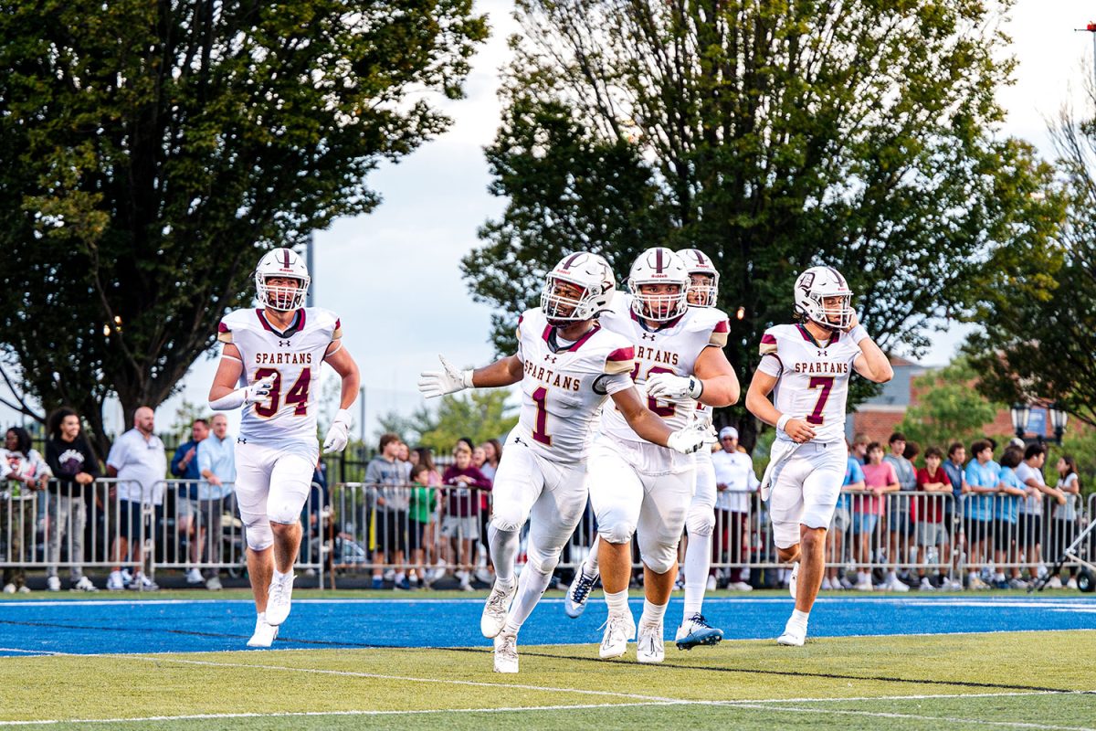 Jayden Mccaster '26 celebrates at the De Smet student section after go-ahead touchdown in the 2nd quarter on September 13th 2024 at SLUH.