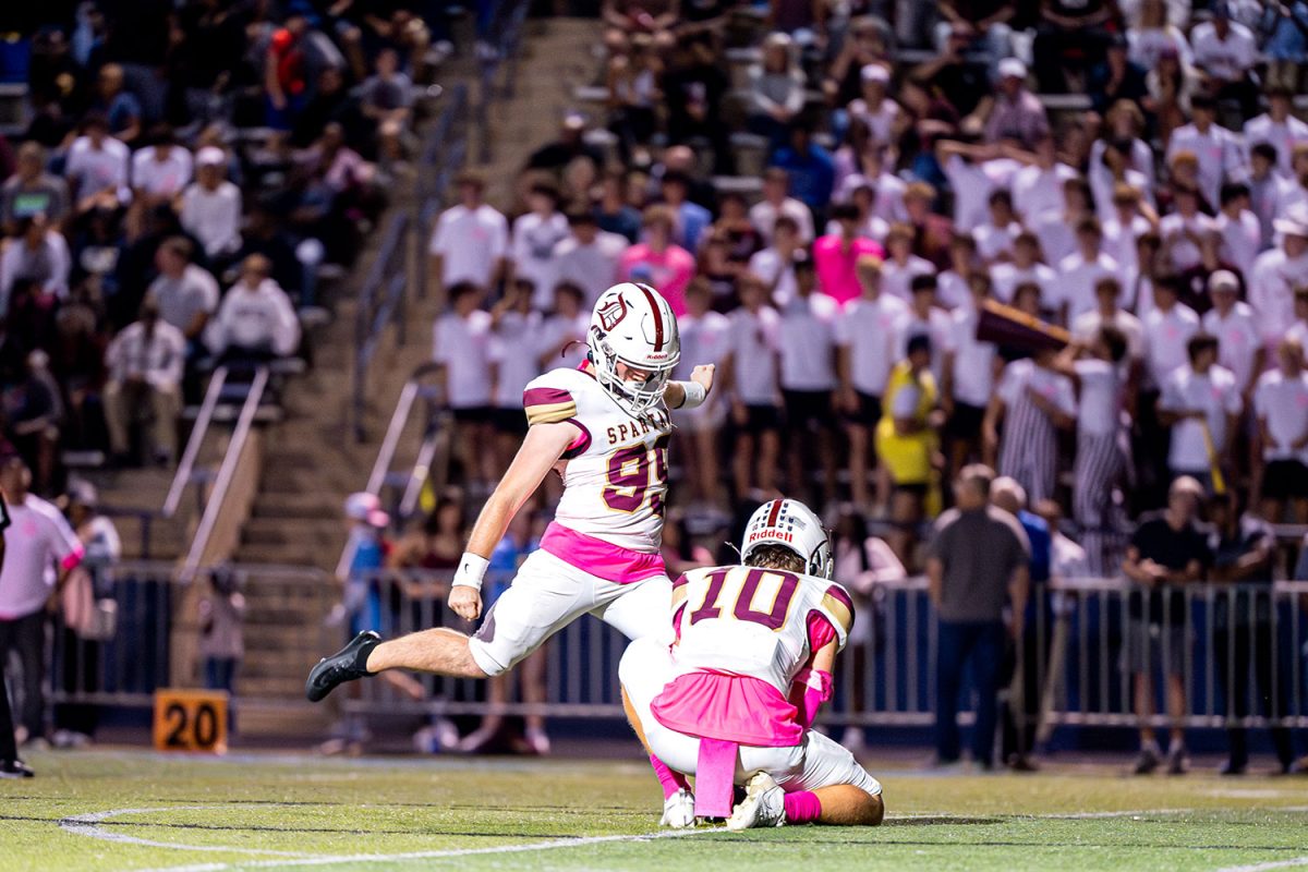 Michael Scally '25 kicks a PAT after Liam Russo '25 scores a touchdown on September 13th 2024 at SLUH.