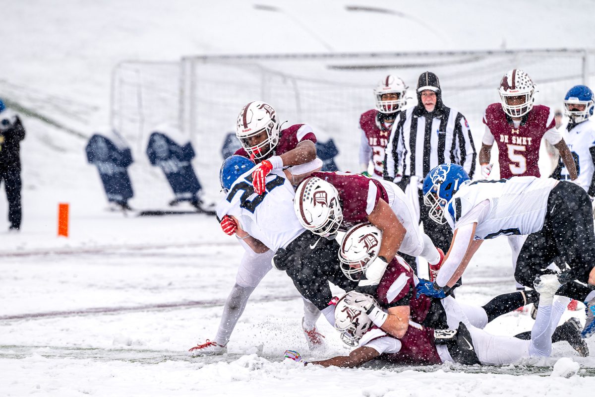 De Smet defenders tackle players from Liberty Kansas City on Saturday November 30, 2024.