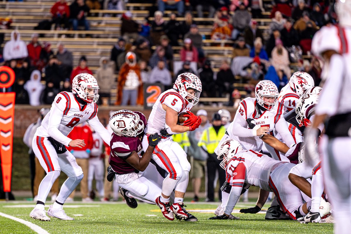 Defensive Lineman Quincy Bias '25 tackles Nixa's running back for loss of yards in the class 6 state championship on Friday December 6, 2024 at Mizzou.