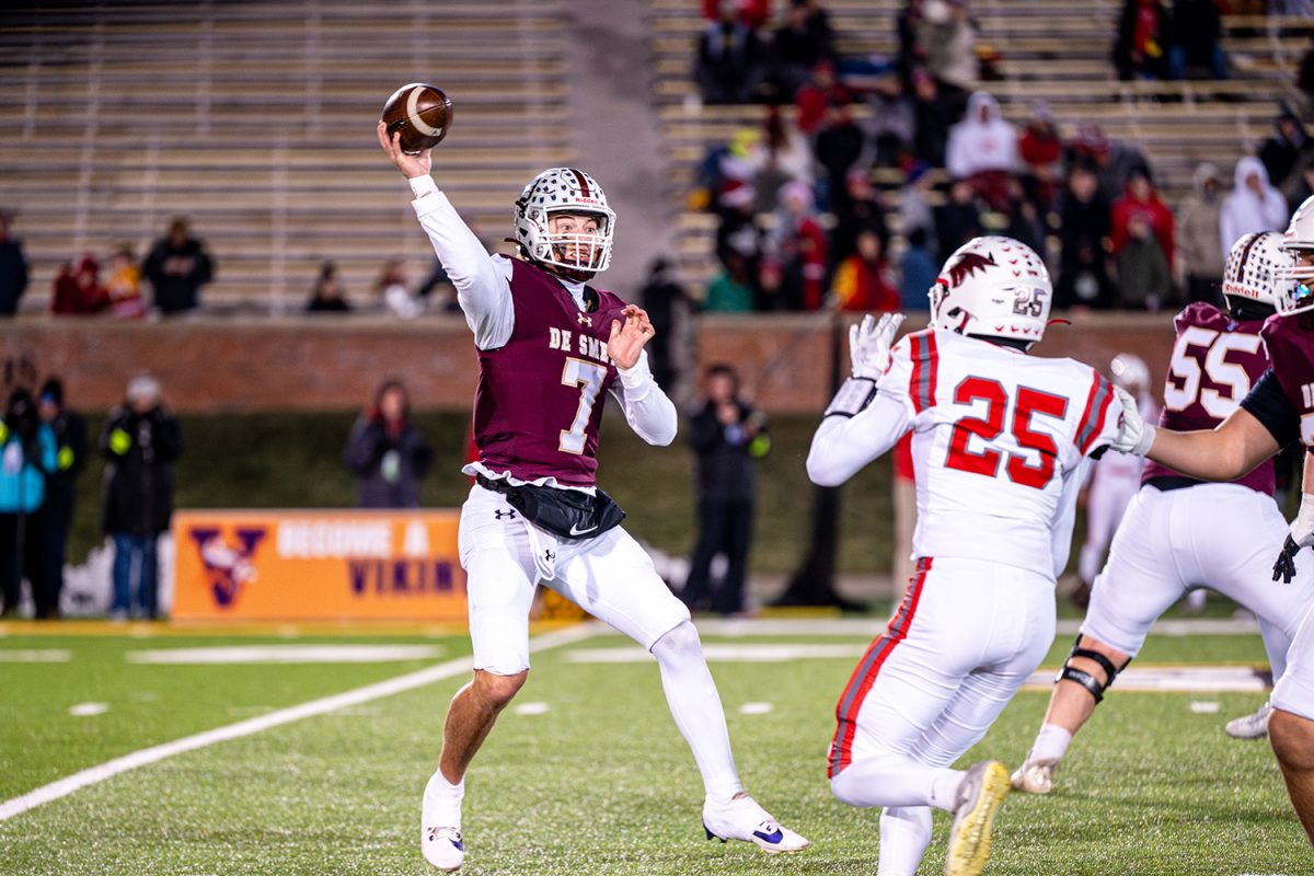 Quarterback Dillon Duff '25 throws ball overtop of Nixa's defender number 25 in the class 6 state championship on Friday December 6, 2024 at Mizzou.