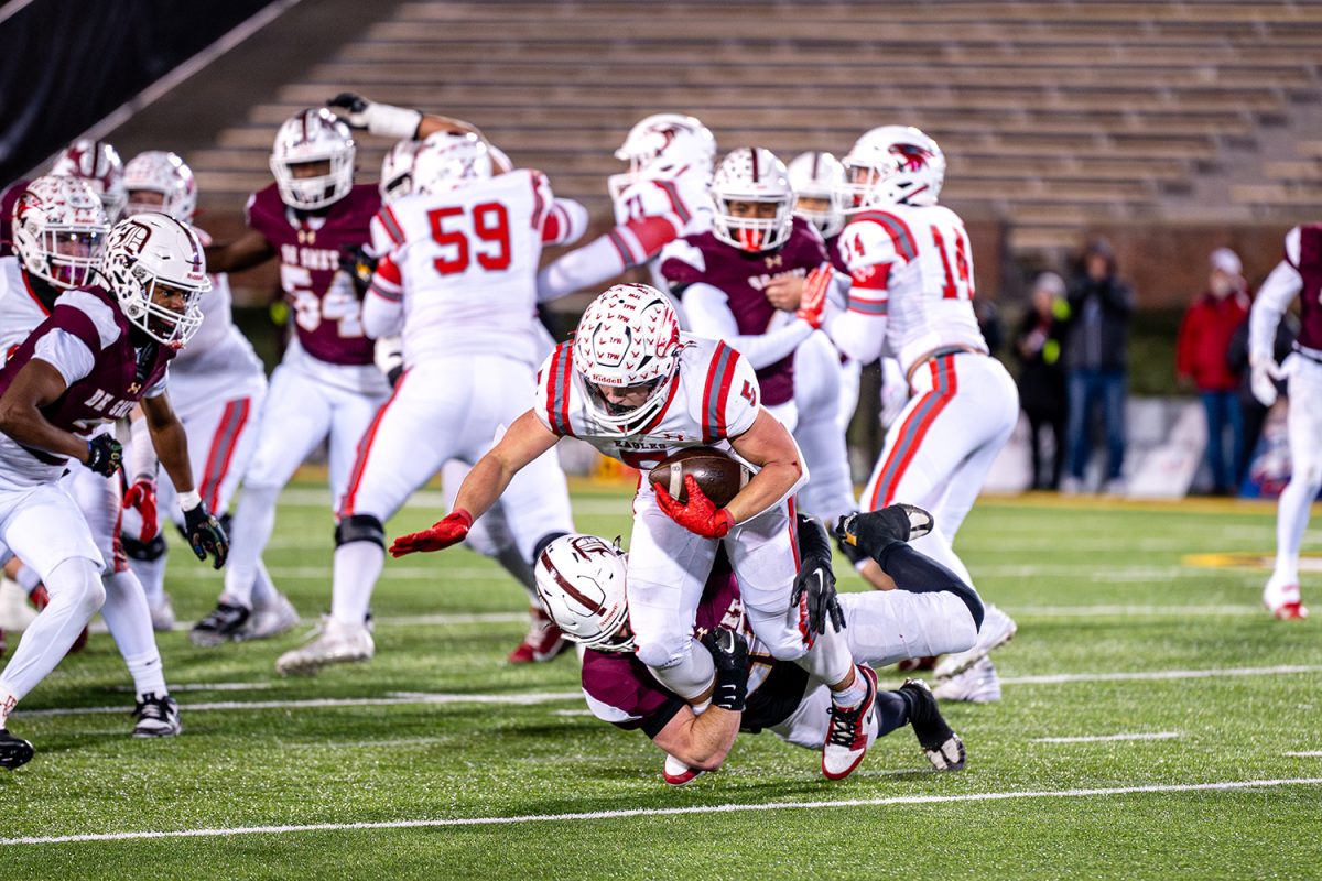 Defender Caynen Patterson '25 tackles Nixa's running back in the class 6 state championship on Friday December 6, 2024 at Mizzou.