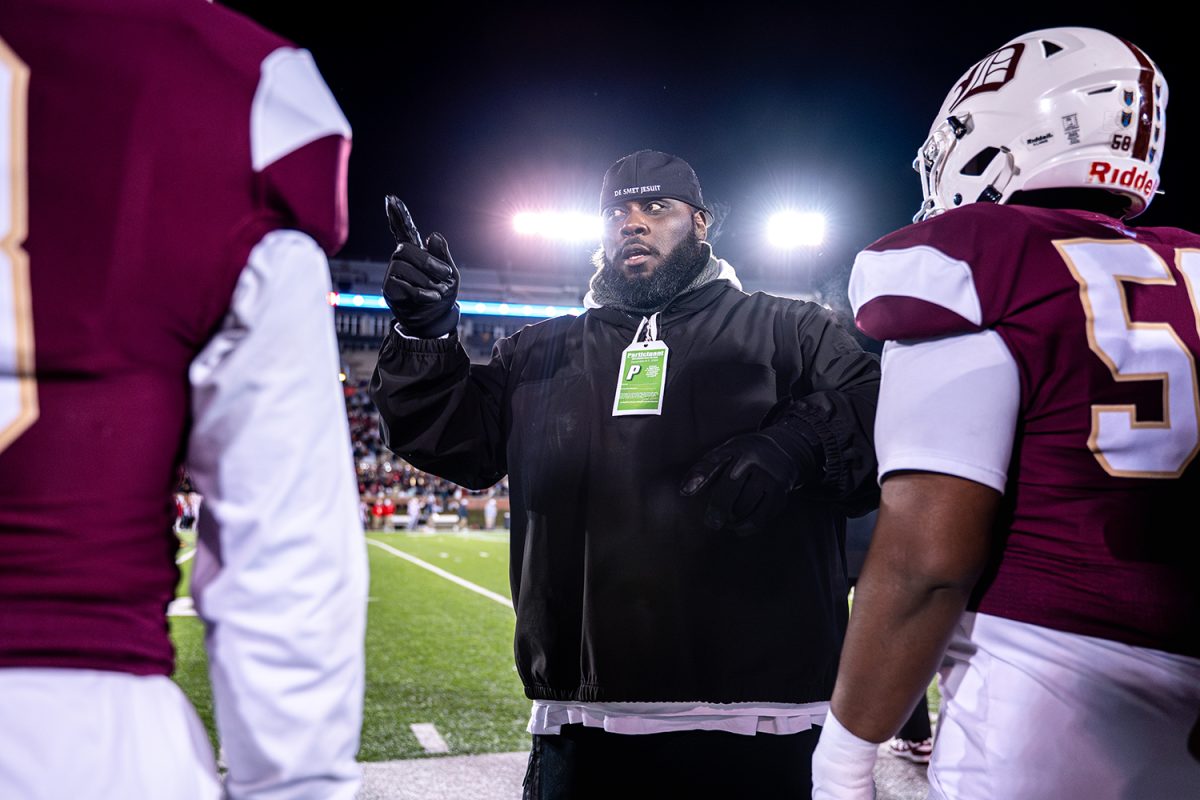 Coach Terrance Poe talks to the football spartans during the state championship game vs Nixa on Friday December 6, 2024 at Mizzou. 