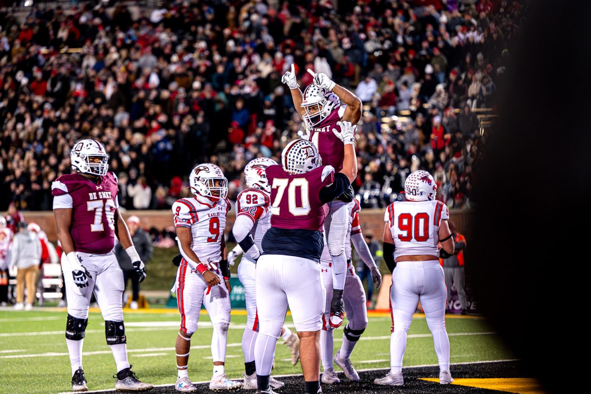 Sam Robinson '25 lifts Jayden McCaster '26 into the air after Statue of Liberty trick play for a touchdown during the state championship on Friday December 6, 2024 at Mizzou. 