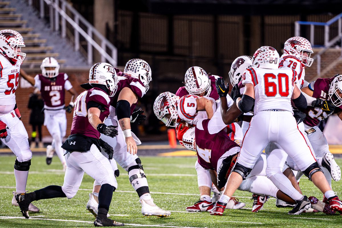 Senior Linebackers Jason King '25 and Bryant Pool '25 tackle Nixa running back during the state championship game on Friday December 6, 2024 at Mizzou. 