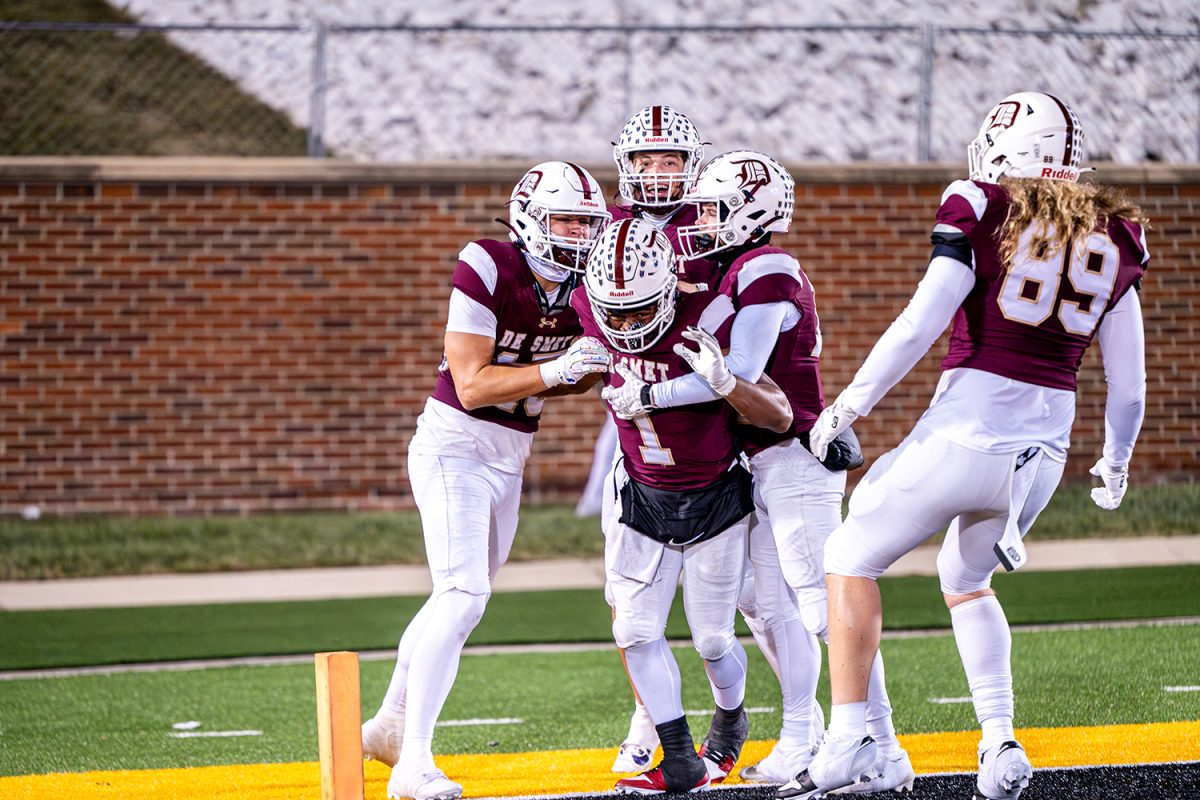 Jayden McCaster '26 celebrates with teammates after his long rushing touchdown to cap off victory in the class 6 state championship versus Nixa on Friday December 6, 2024 at Mizzou. 