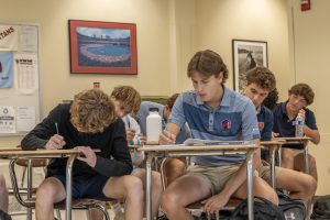 Josh Loughman ‘25 works along side his peers in period two college algebra and stats taught by Mr. Mark DeGreeff.