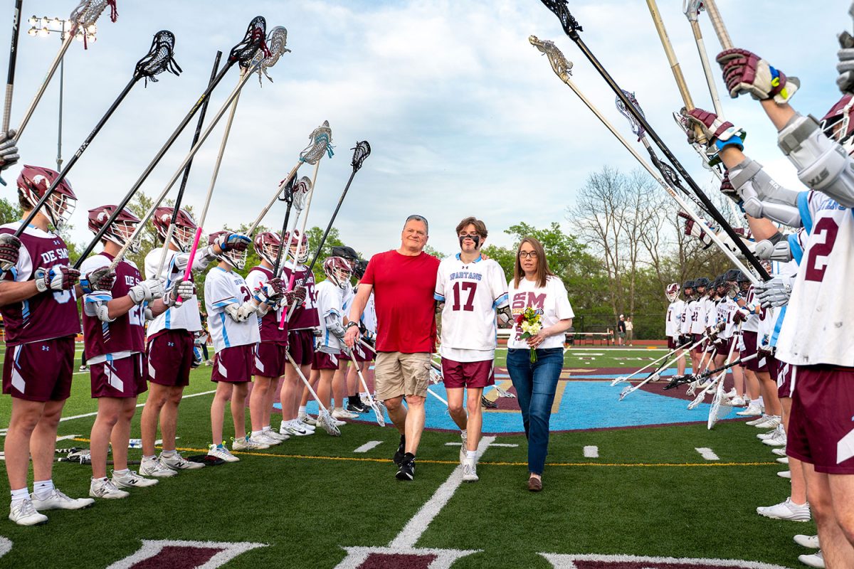 Owen Wampler '25 walks with parents for senior celebration on April 23rd, 2025.