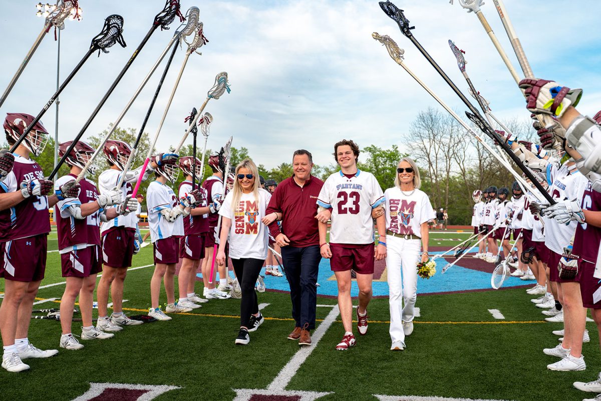 Gregory Clemons '25 walks with family for senior celebration on April 23rd, 2025.