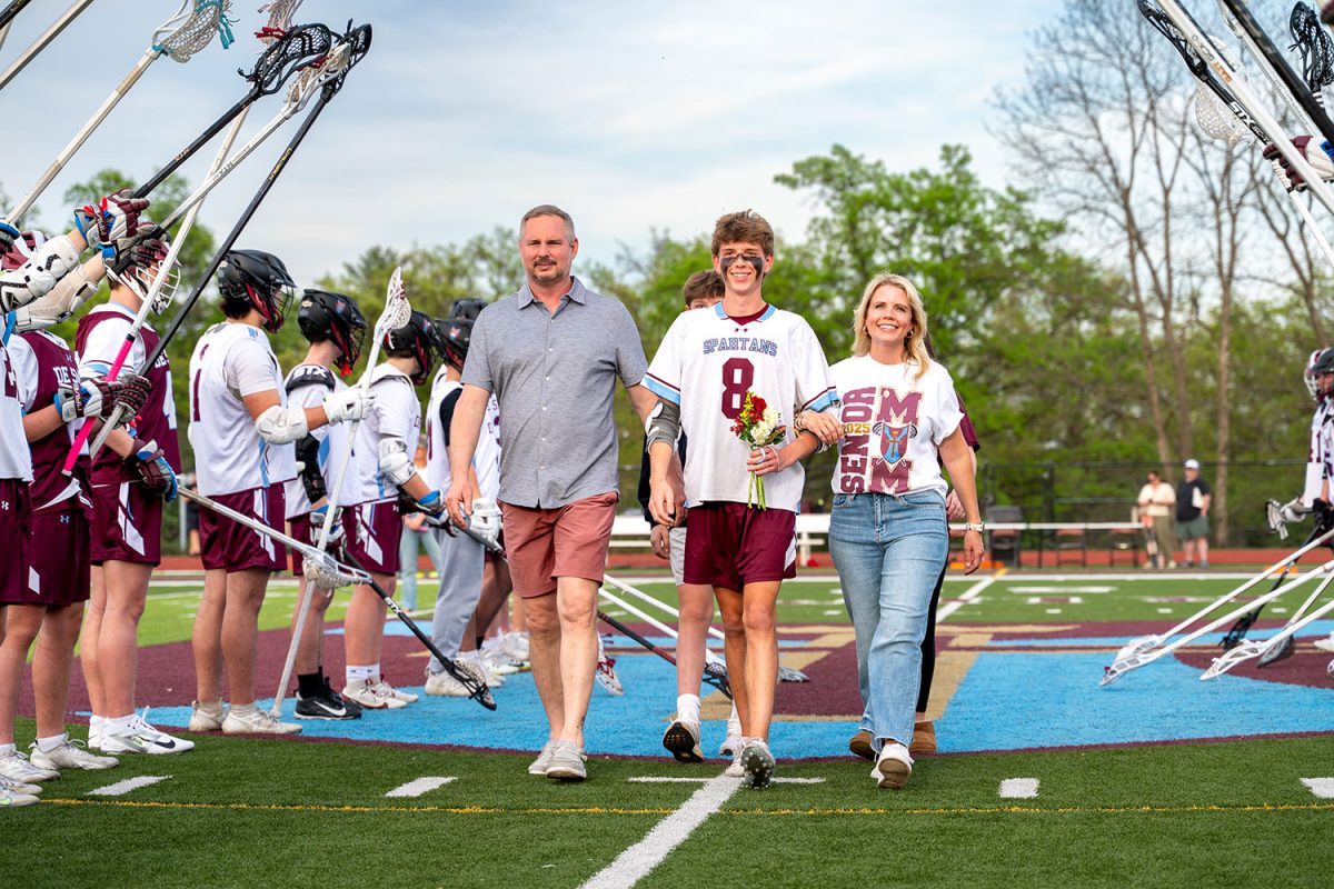 Ben Gibson '25 walks with family during senior celebration on April 23rd, 2025.