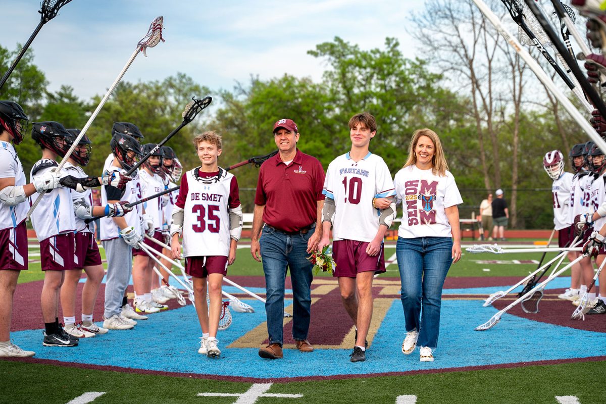 Michael Sullivan '25 walks with family for senior celebration on April 23rd, 2025.