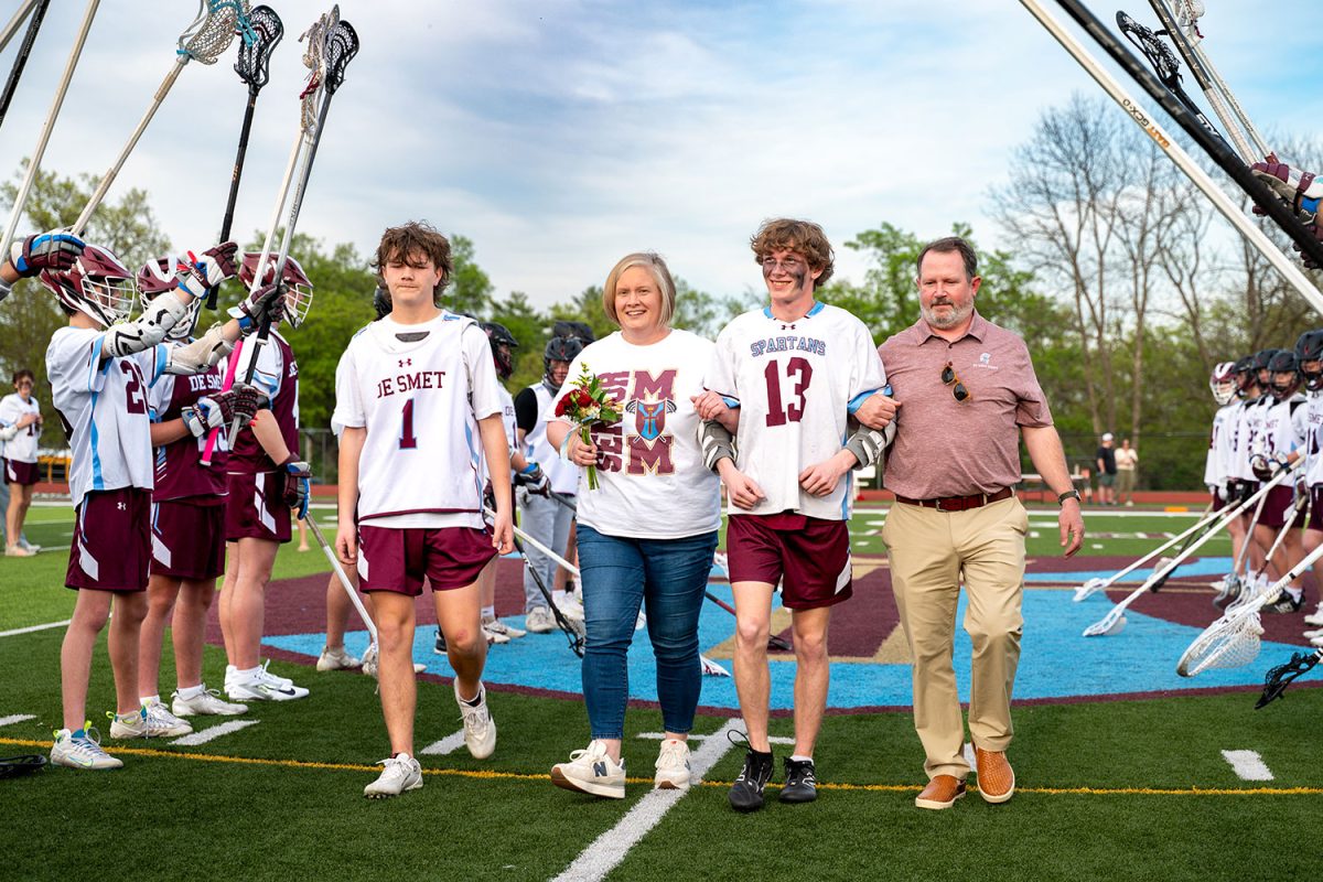 William Puckett '25 walks with family for senior celebration on April 23rd, 2025.