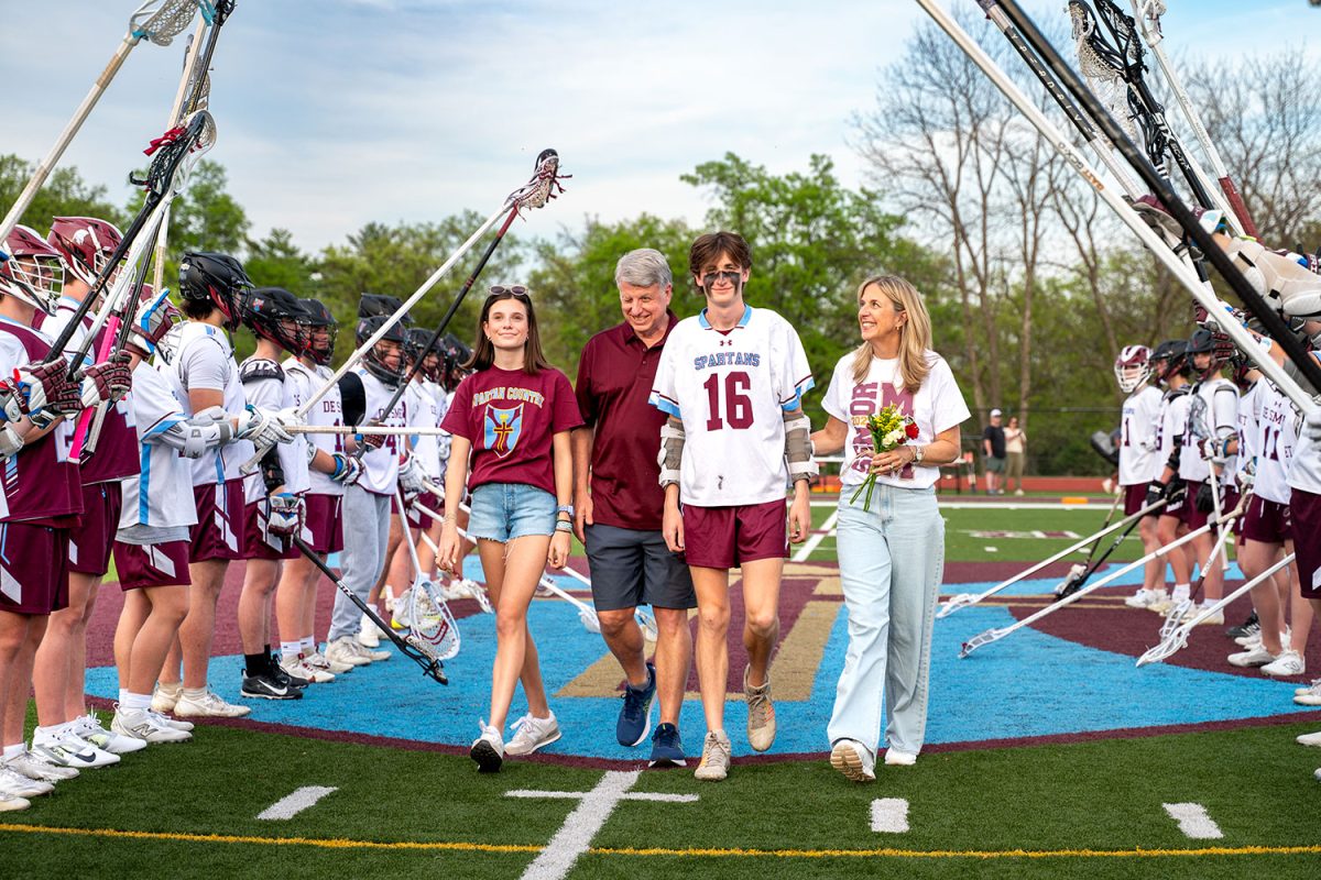 Patrick Akins '25 walks with family for senior celebration on April 23rd, 2025.