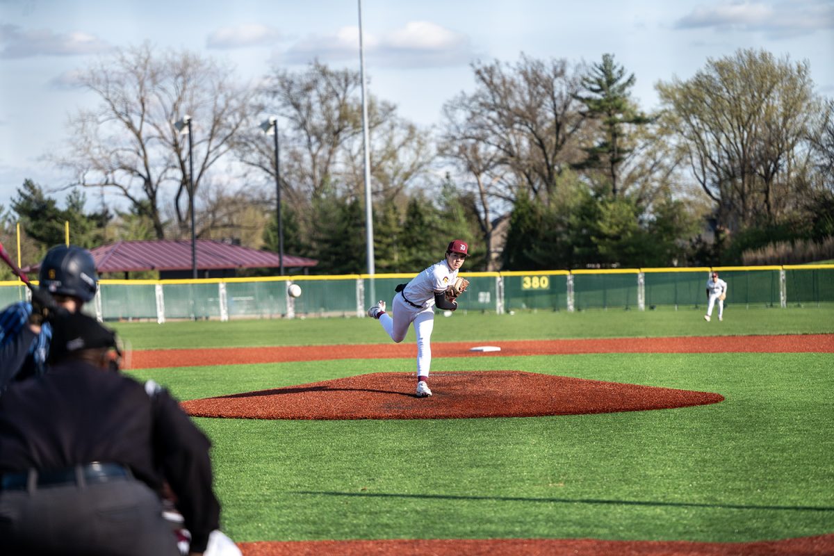 Brayden Wakula ('25) pitches the ball on Monday, March 31, vs. St. Dominic.